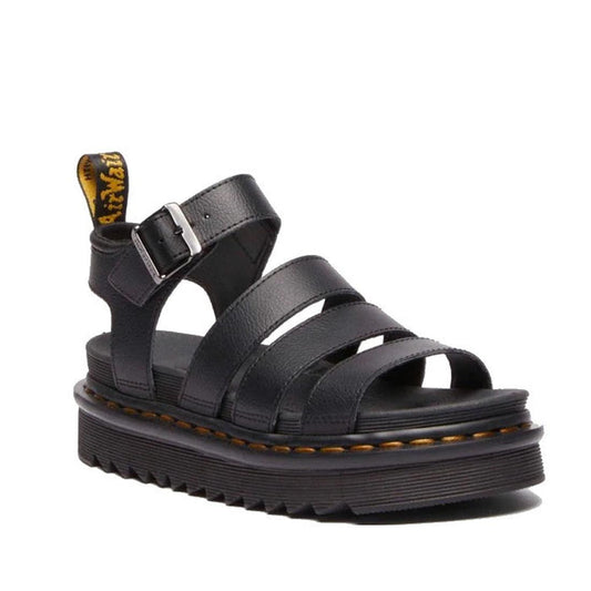 The Dr Martens Blaire Black Athena 3 Strap Sandal features three wide leather straps, an ankle strap with a silver buckle, a thick ridged sole with yellow stitching, and a black and yellow branded pull tab at the back.