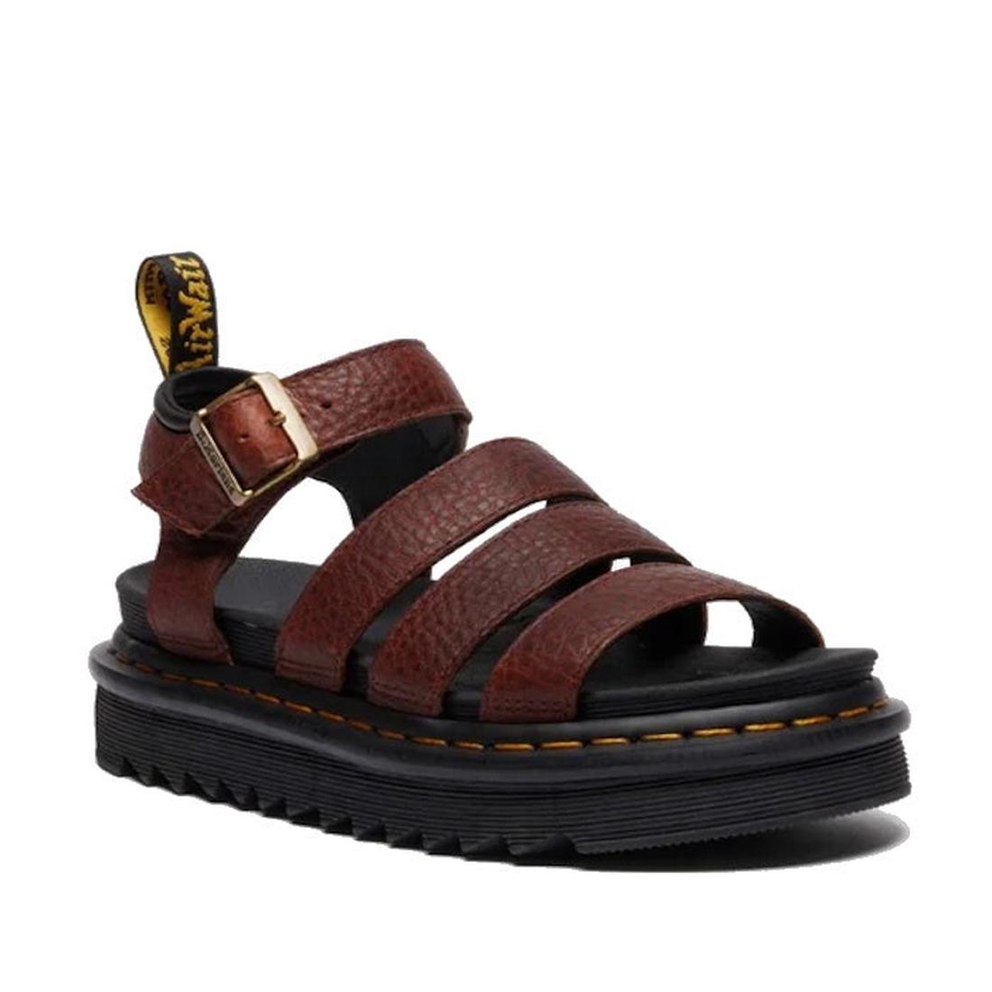 The Dr Martens 3 Strap Blaire Sandal in Cashew Ambassador Leather Tan features three straps, a gold buckle, black ridged sole, yellow stitching, and a branded heel tab—classic Blaire style with lightweight comfort.