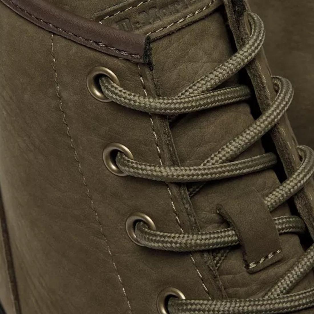 Close-up of the Dr Martens Brookline Chukka Boot in olive milled nubuck leather, featuring matching round laces through metal eyelets. The detailed leather texture and stitching show classic Dr. Martens inspiration., 51342, 190665797053, 190665797060, 190