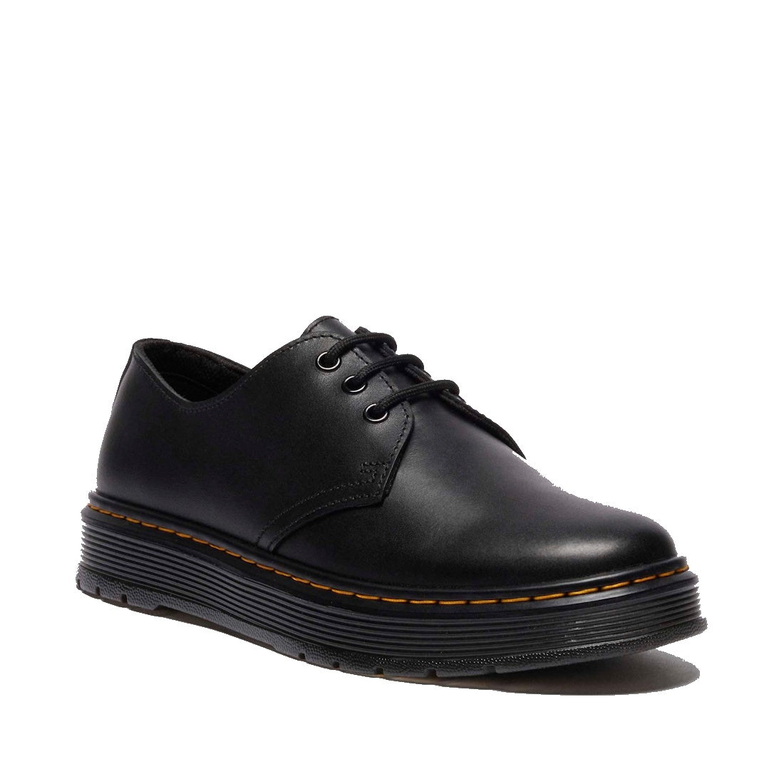 The Dr. Martens Brookline Dark Black Lusso Leather Shoe is a lace-up oxford featuring lightweight leather, a thick ridged sole, and signature yellow stitching along the edge.