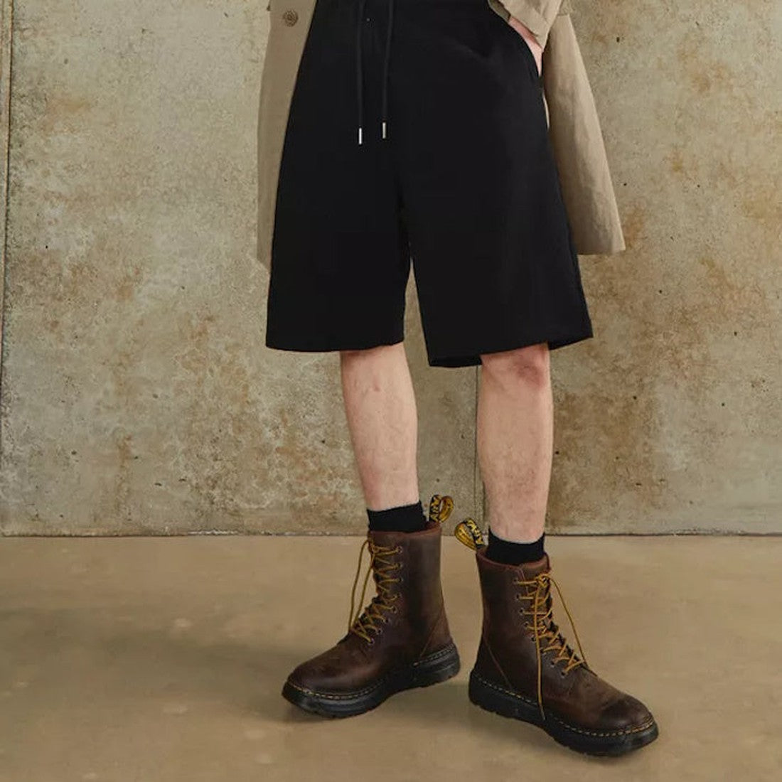 Dr. Martens Doc Crewson Classic Leather Everyday Boots in Crazy Horse Brown, lace-up style with sturdy sole, worn indoors by a teen.  ksnz, 190665608861, 190665608878, 190665608885, 190665608908, 190665608915, 190665608922, 190665608946