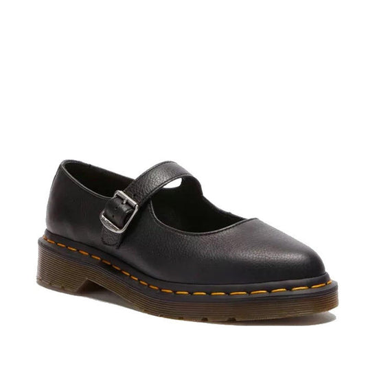 A single Dr Martens Elphie MJ Mary Jane Shoe in black Virginia leather with a buckle strap, chunky brown sole, and yellow stitching is shown facing left on a plain white background.