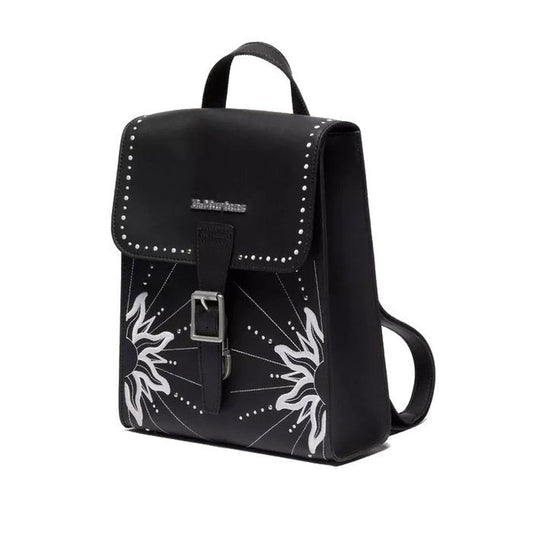 The Dr Martens Mini Genix Nappa Solar Flare Leather Backpack in black features a flap closure with a silver buckle, sunburst and stud details, plus a top handle and shoulder straps for style and versatility.