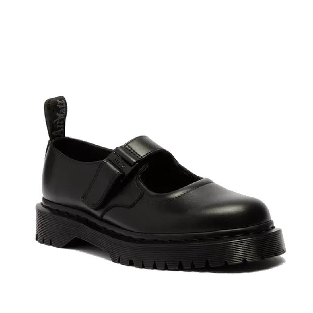 The Dr Martens Bex Indica II Mary Jane Tech Nappa Mono Black features black leather, a thick ridged sole, rounded toe, adjustable strap, and a pull tab at the heel for easy on/off.