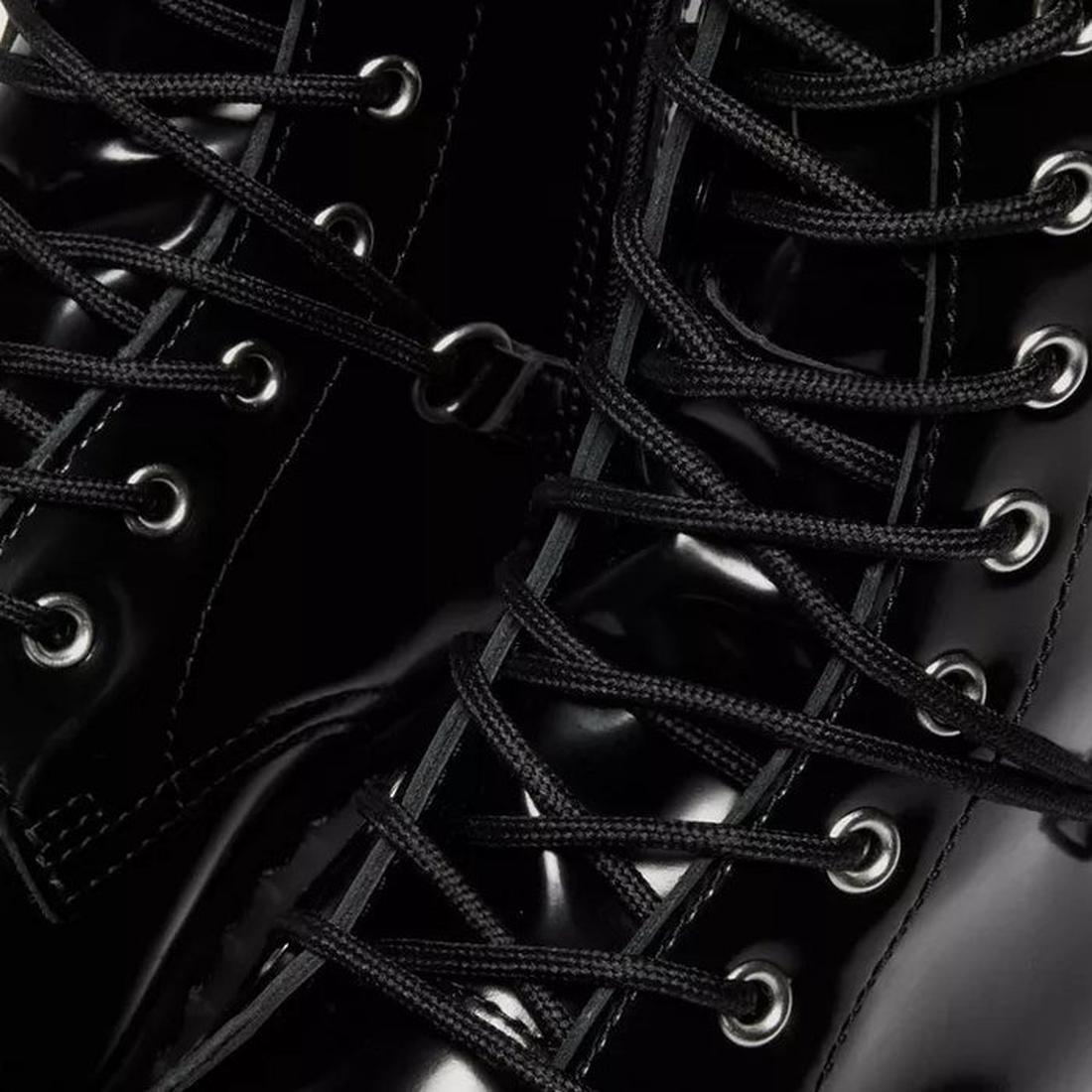 Close-up of Dr Martens Jadon Hi HDW Hardware Buttero Platform Black Boots, featuring a shiny black finish, metal eyelets, detailed stitching, and black laces on a bold platform sole., 190665797862, 190665797879, 190665797893