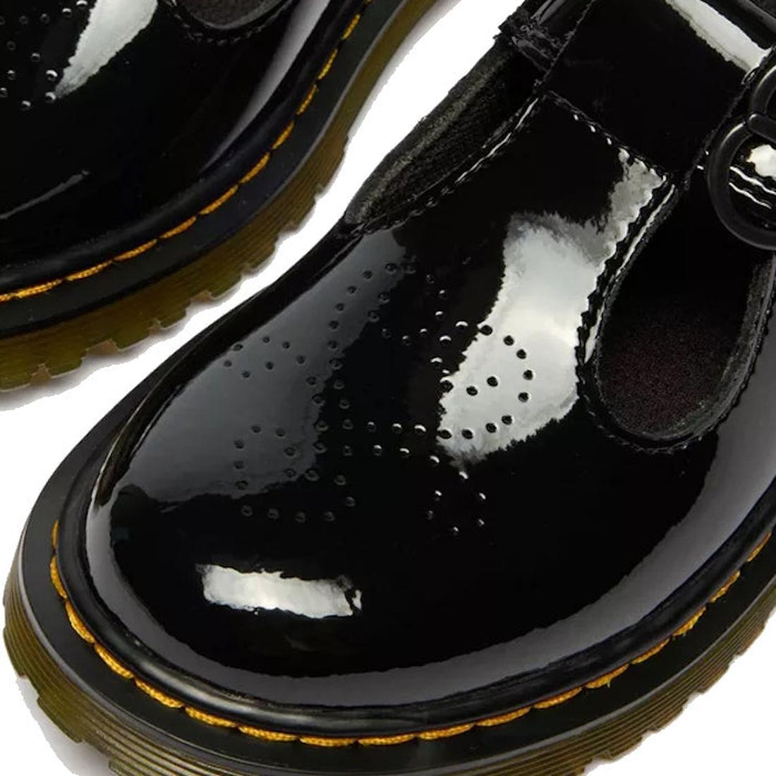 Close-up of Dr Martens kids Polley II Heart T Bar Junior Black Patent shoes with yellow stitching, thick soles, T-bar straps, and heart perforations—perfect as stylish school shoes., 50432, 50433, 190665786743, 190665786750, 190665786651, 190665786675, 19