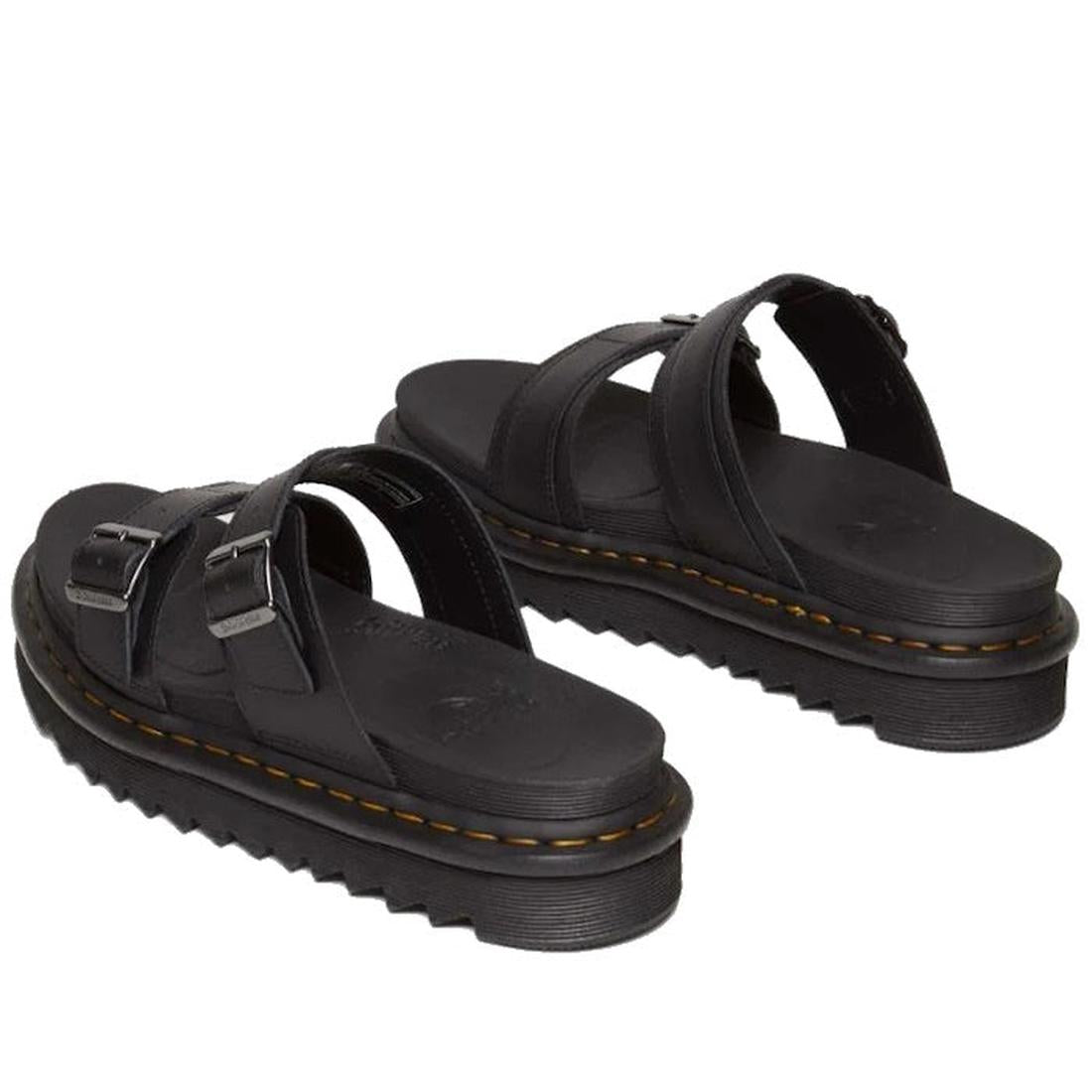 A rear shot of a pair of Dr Martens Black leather pper Myles Slides sandale showing the moulded footbed and yellow stitching around the sole.,
190665653779,
190665653786,
190665653793,
190665653816,
190665653823,
190665653830,, 42798, 190665653779, 190665