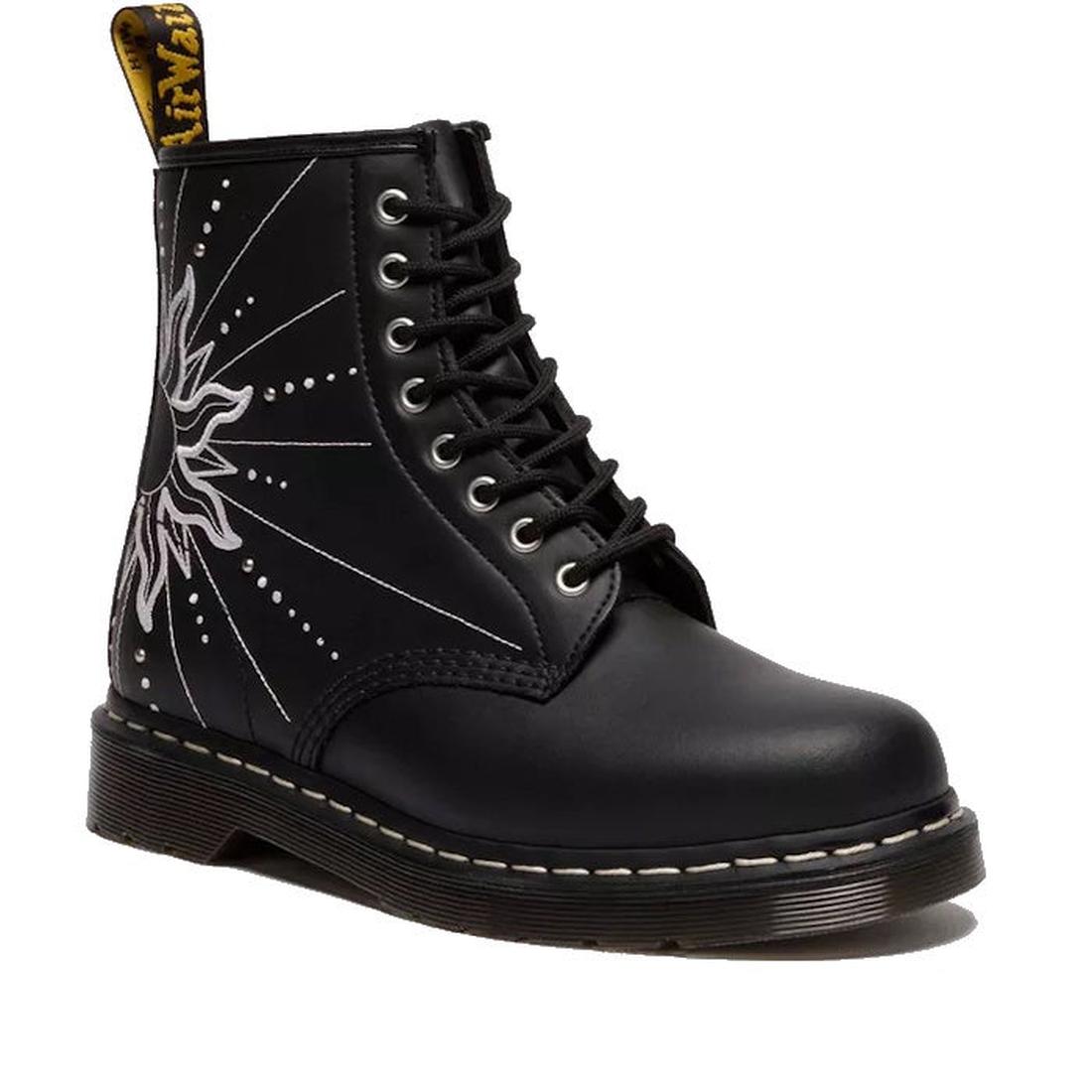 Introducing the Dr Martens 1460 Genix Solar Flare Black 8 Eye Boot: a black lace-up style in Genix Nappa leather, detailed with white stitching, a sunburst design, and a signature yellow pull tab.