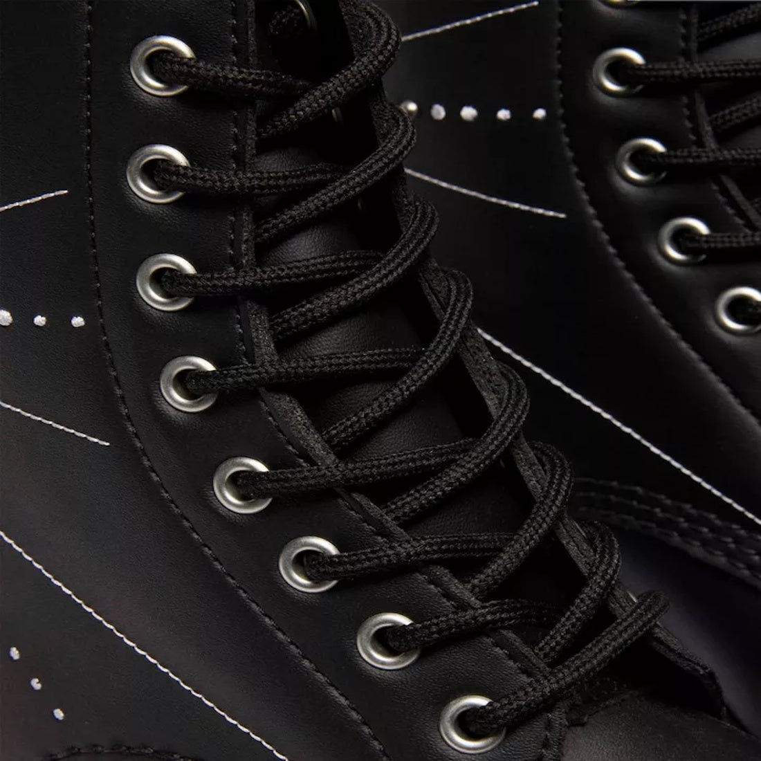 Close-up of Dr Martens 1460 Genix Solar Flare Black 8 Up Eye Boot, featuring black laces threaded through metal eyelets and white stitching details, emphasizing the lacing and boot’s exterior design., 190665742824, 190665742831, 190665742848, 190665742862