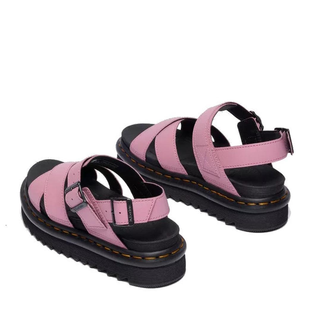 A pair of Dr Martens - Voss II Cross Strap Sandal in Dusty Rose Pink, featuring chunky black soles, ankle straps, and buckle closures, is shown from the back on a white background., 50439, 190665777529, 190665777536, 190665777543, 190665777567, 50444, 504