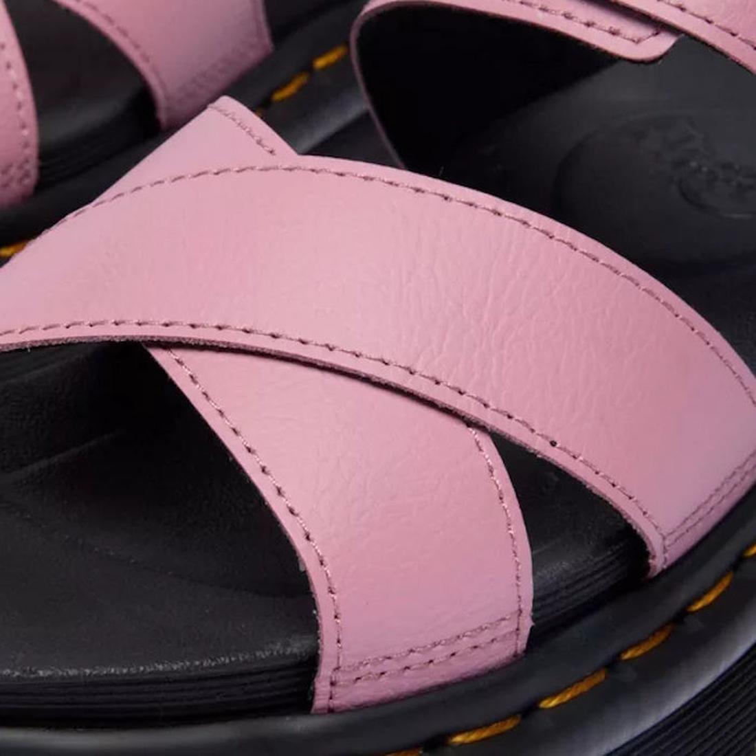 Close-up of Dr Martens - Voss II Cross Strap Sandal in Dusty Rose Pink, showcasing Athena Leather crisscross straps over a black footbed with signature yellow stitching on the sole., 50439, 190665777529, 190665777536, 190665777543, 190665777567, 50444, 50