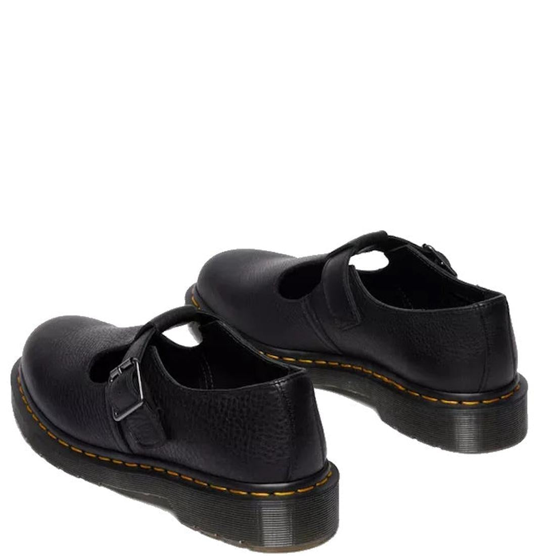 A rear heel shoe of a pair of black Dr Martens Polley T Bar  shoes with buckles on a white background.,
190665740530,
190665740547,
190665740561,, 46179, 46180, 190665740530, 190665740547, 190665740561, 46185, 46186
