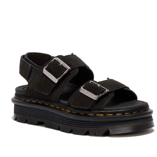 The Dr Martens Zebzag Black EH Suede 2 Strap Sandal w/Back Strap features two thick suede straps with silver buckles, a back strap, and an ergonomic chunky ridged sole with visible yellow stitching around the edge.