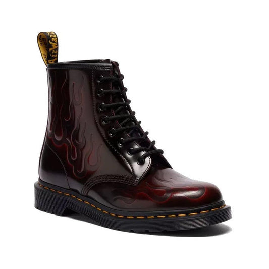 A single Dr Martens 1460 Inferno Cherry Red Arcadia Unisex Leather Boot with an embossed flame print, black laces, yellow stitching around the sole, and a yellow pull tab at the back.