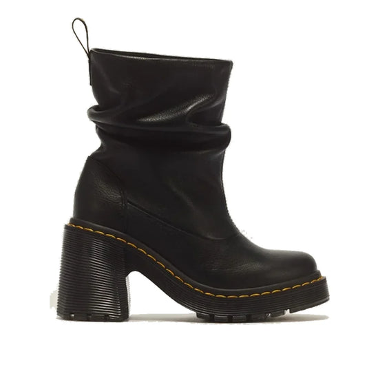 A black Dr Martens Womens Kasey Lo Pull On Boot, crafted from soft Virginia leather, features a chunky heel and sole, rounded toe, signature yellow stitching, and a slightly slouched shaft—these women’s ankle boots offer both added height and comfort agai