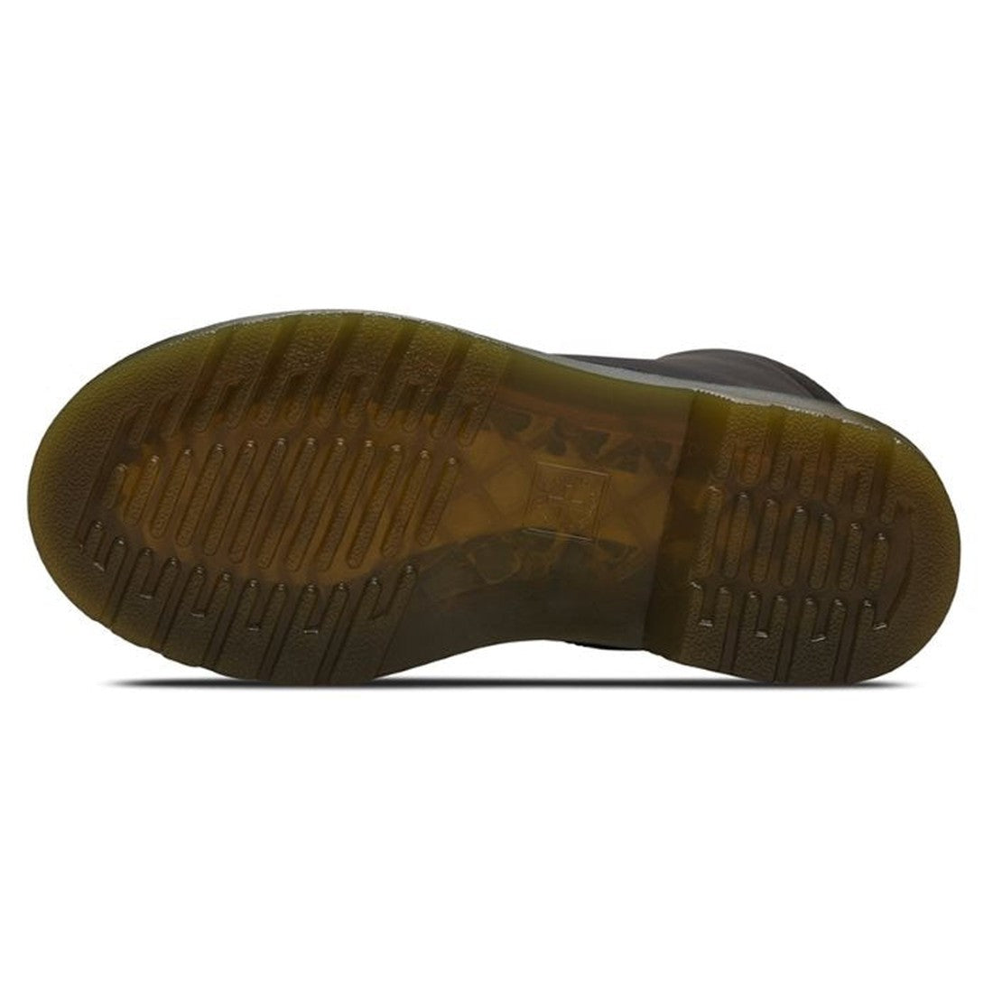 The image displays the translucent, textured sole of the Dr Martens kids - 1460 J Black Lace Up Boot with zip, featuring horizontal ridges and grooves for traction and a subtle greenish-brown tint., 883985597518, 883985597525, 883985597549, 883985597556, 