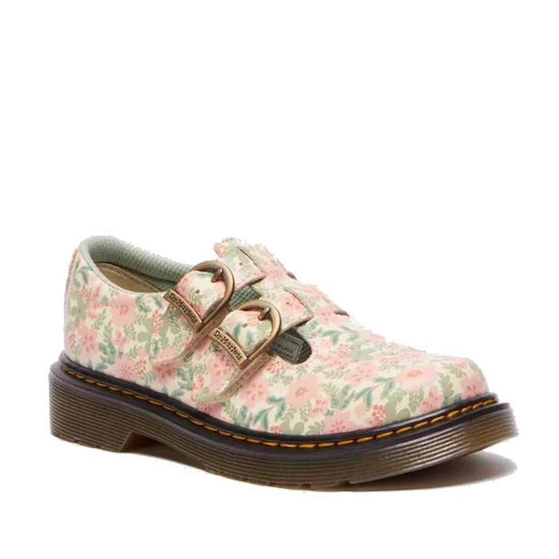 The Dr Martens Kids 8065 J Cloud Cream Floral T Mary Jane Leather Shoe, made from Athena leather, displays a floral pattern with pink and green flowers. It includes two FAKE buckle straps, they are actually velcro, a rounded toe, and a brown chunky air-cu