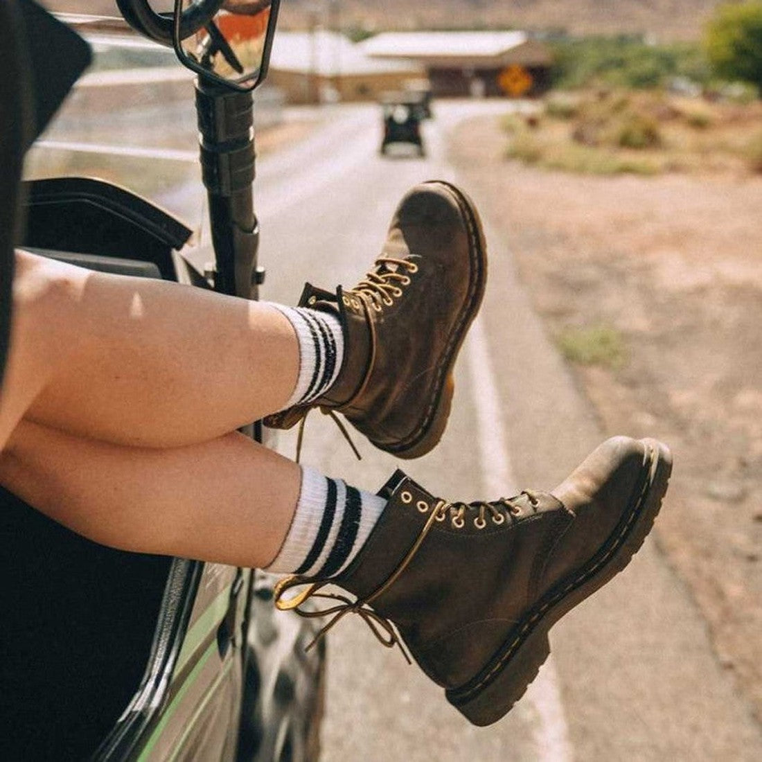 person wearing brown boots in an open vechile with the egs and feet out the window,
800090827903,
800090827927,
800090796971,
800090796995,
800090827972,
800090797008,
800090797015,
800090797039,
800090797046,
800090797053,, 800090827903, 800090827927, 80