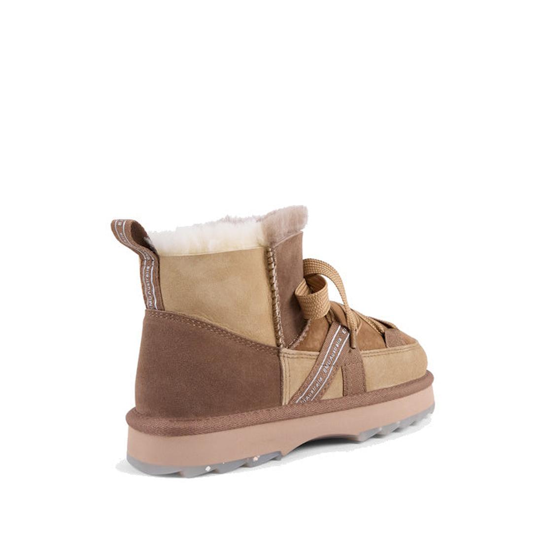 The EMU Women's Blurred Micro Patchwork Sheepskin Boot in Mushroom is a tan and brown, water-resistant suede boot with a thick sole, white Australian sheepskin lining, and decorative pull tabs, shown from the back left angle., 47429, 9330071978207, 933007