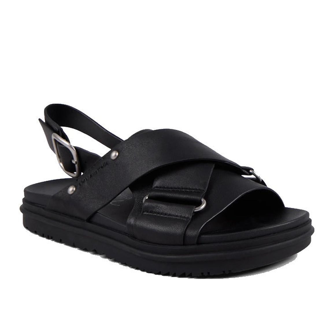 The Emu Faye Black Leather Sandal features a thick sole, cushioned footbed, crisscross leather straps with silver ring accents, adjustable slingback buckle, and an open toe for effortless style.