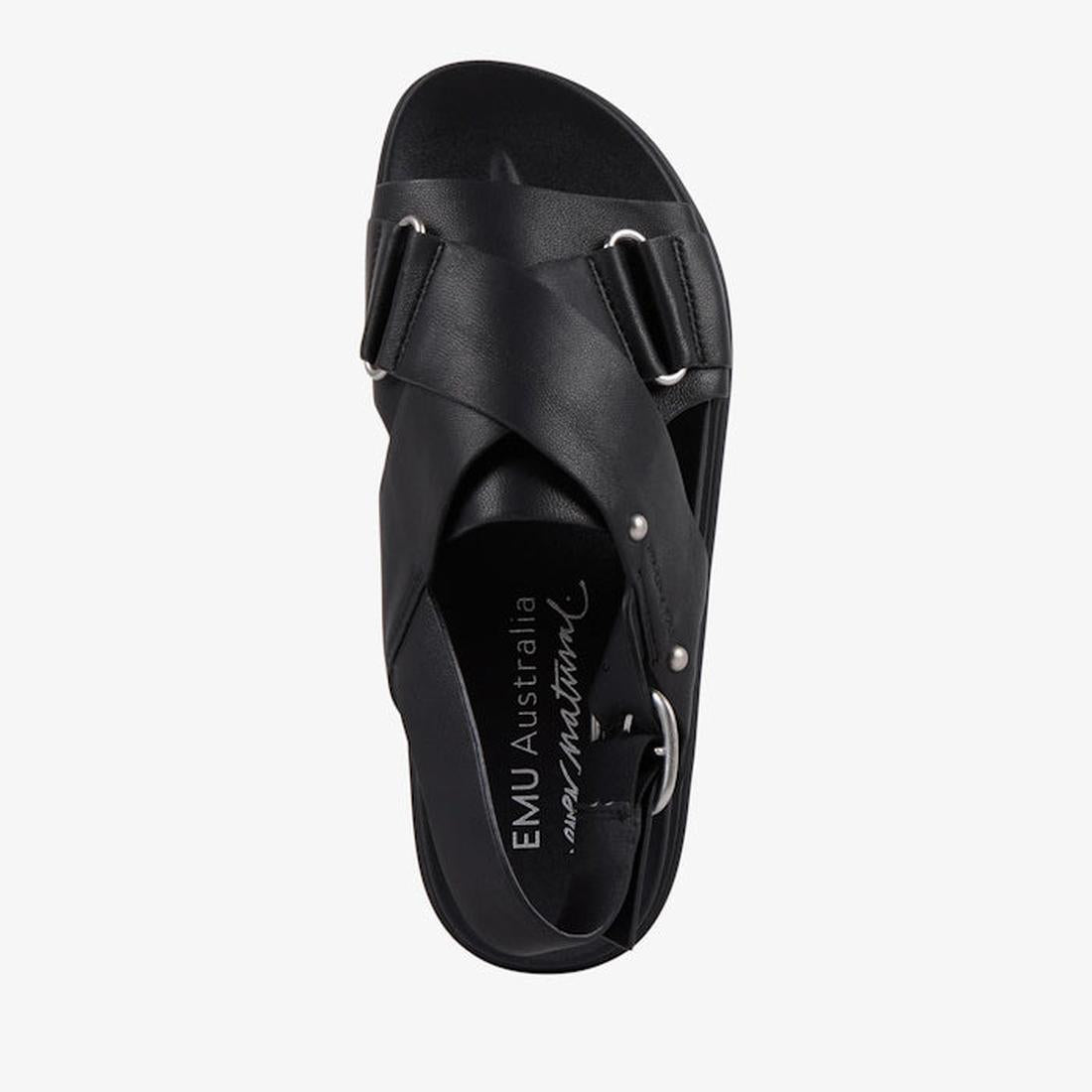 Top view of the Emu Faye Black Leather Sandal w/Back Strap featuring crisscross straps, adjustable buckle, open toe, and comfy footbed with EMU Australia in white letters. Displayed on a plain white background., 9330071983119, 9330071983126, 9330071983133