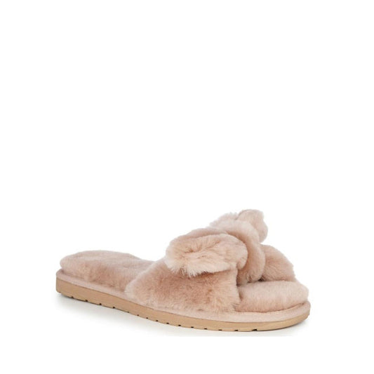 The EMU Women's Naledi Camel Slipper w/Bow features fuzzy, light beige straps and flat textured soles, shown against a plain white background.