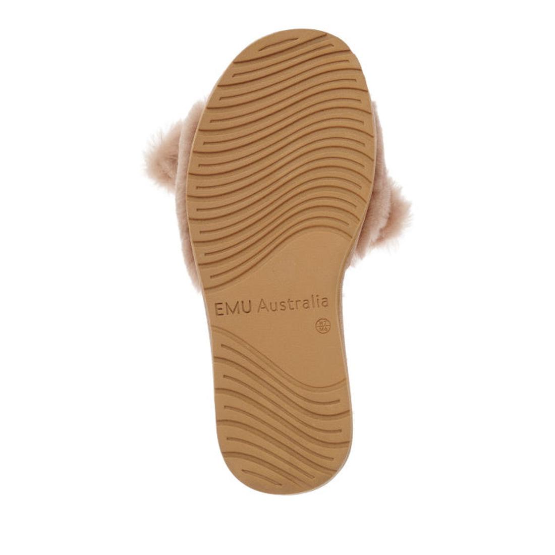 A tan rubber sole with wavy treads and EMU Australia embossed at the center, shown from below. Soft, light brown fur from the EMU Women's Naledi Camel Slipper w/Bow is visible around the upper edges., 9330071899489, 9330071899496, 9330071899502, 933007189