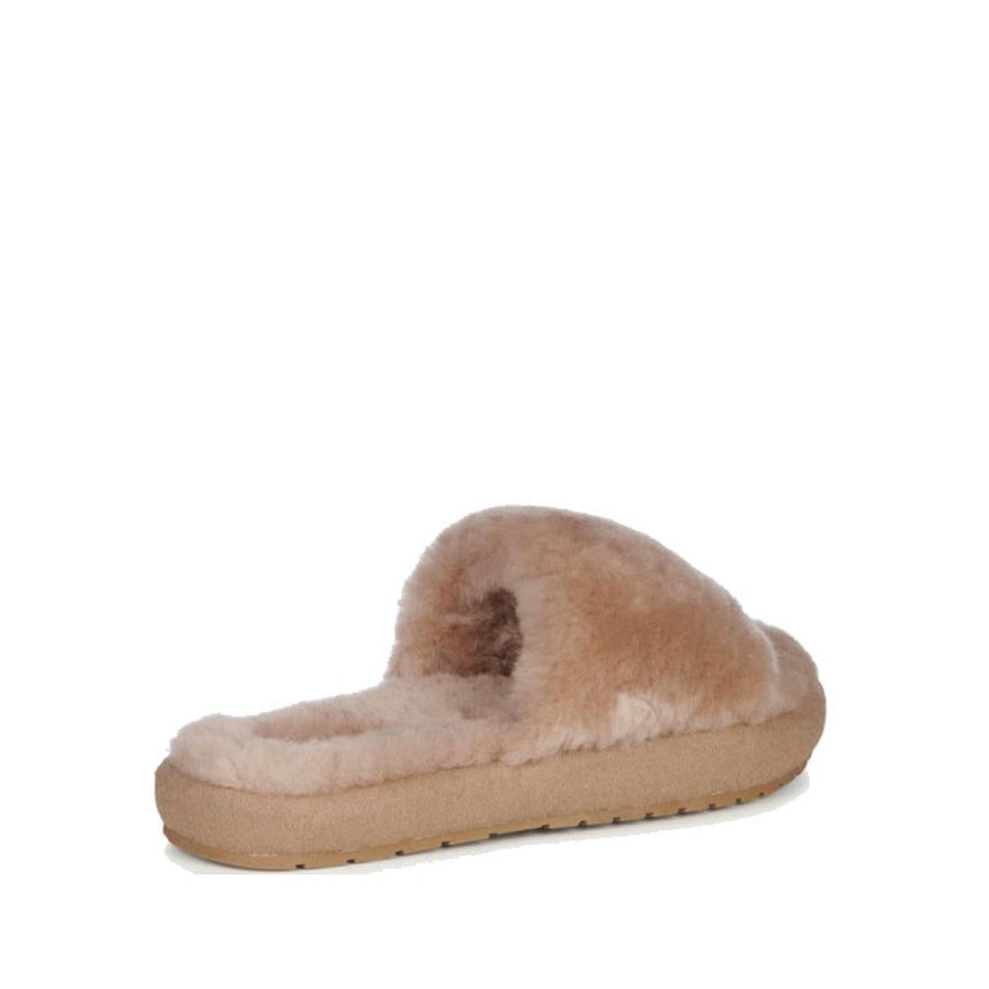 The heel to front view of the right outer foot of the EMU Mckay scuff Slide slipper in Cmael beige sheepskin. Shows the sheepskin on the foot bed and unber the strap that goes over the top of the foot. A slightly thicker cushiones beige sole.,
93300719628