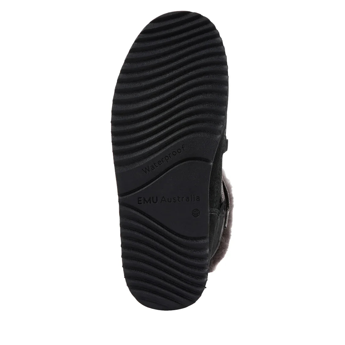 The image displays the black rubber sole of the Emu Womens Thorsby Black Sheepskin Ankle Boot Waterproof by EMU Australia, featuring wavy treads, a waterproof label, and visible fur lining for comfort and dependable winter wear., 9330071980507, 9330071980