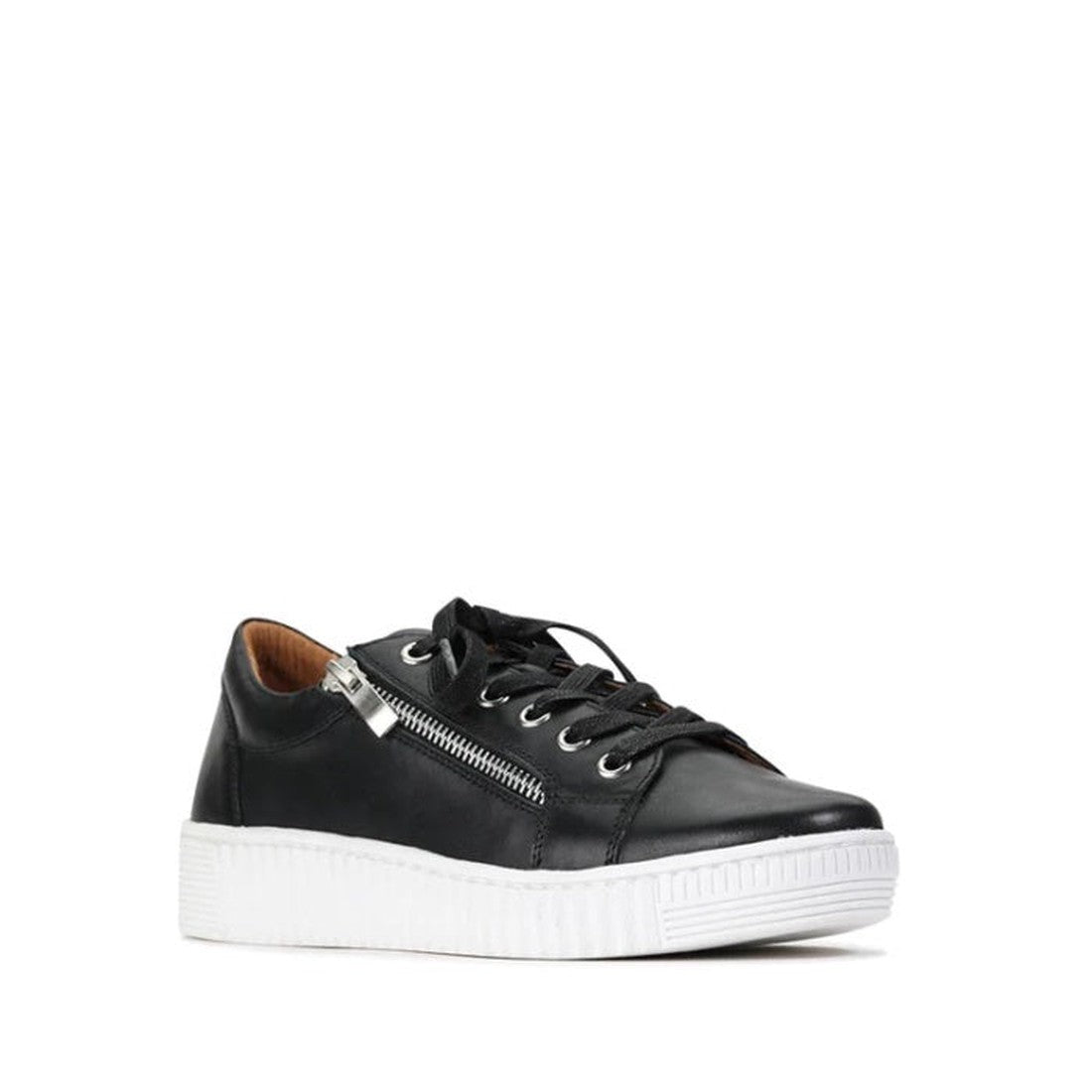 The EOS Joyce Leather Trainer is shown in black Italian Aniline leather with black laces, a side zipper, and a thick white sole against a plain white background. The shoe is angled to highlight both the side and front views.