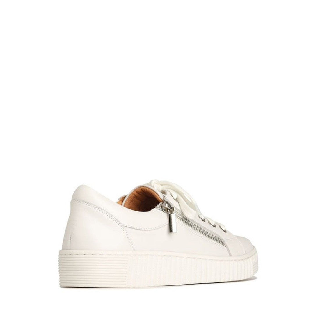 The EOS Joyce Leather Trainer features a white low-top design in Italian Aniline leather, with a thick sole, side zipper detail, and white laces, displayed from a rear side angle on a plain white background., 9321191044484, 9321191044491, 9321191044507, 9