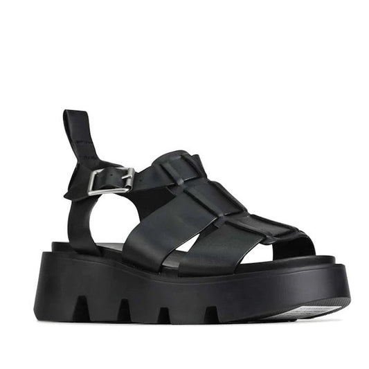The EOS Womens Kailan Platform Chunky Leather Sandal in Black features wide leather straps, a silver buckle, and a thick ridged sole, all showcased against a white background.