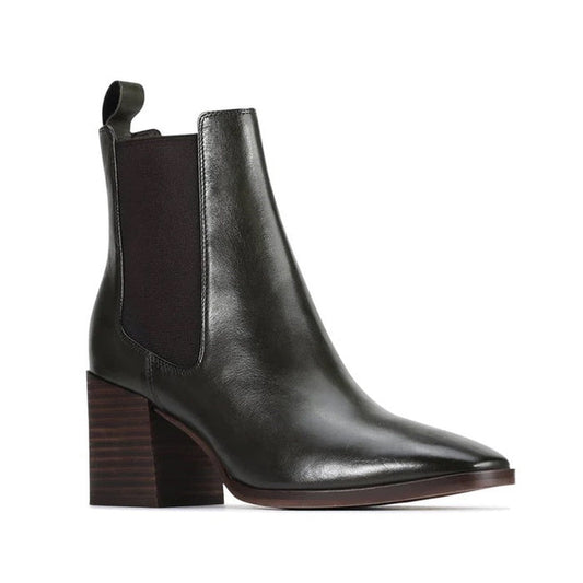 The EOS Kelcie Black Leather Boot is a women's pull-on Chelsea style featuring a pointed toe, block heel, elastic side panels, and back pull tab—blending comfort and style in sleek black leather. Photographed on a white background.