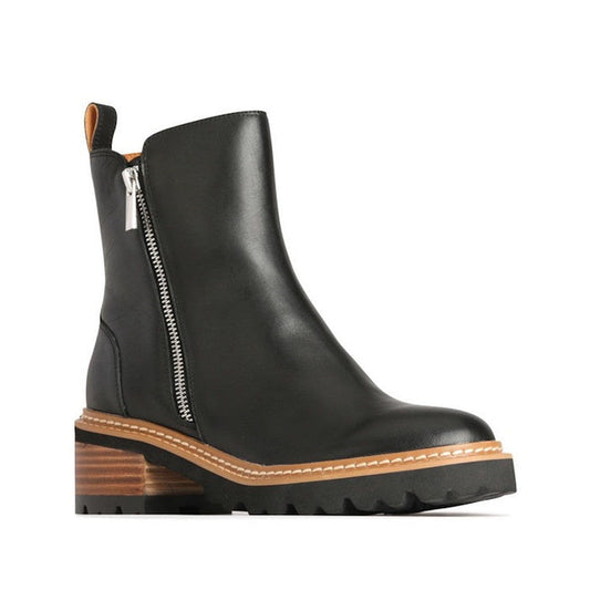 EOS Lindira women’s boot in black leather, with side zip and wood-look heel. Right Foot Outside of leg view from the front.