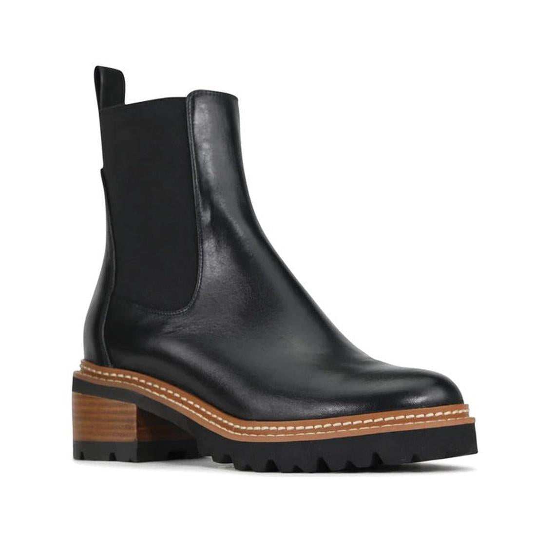 EOS Linear women’s boot in Black leather with side gussets, block heel, and lugged sole. Side View of Right Foot 