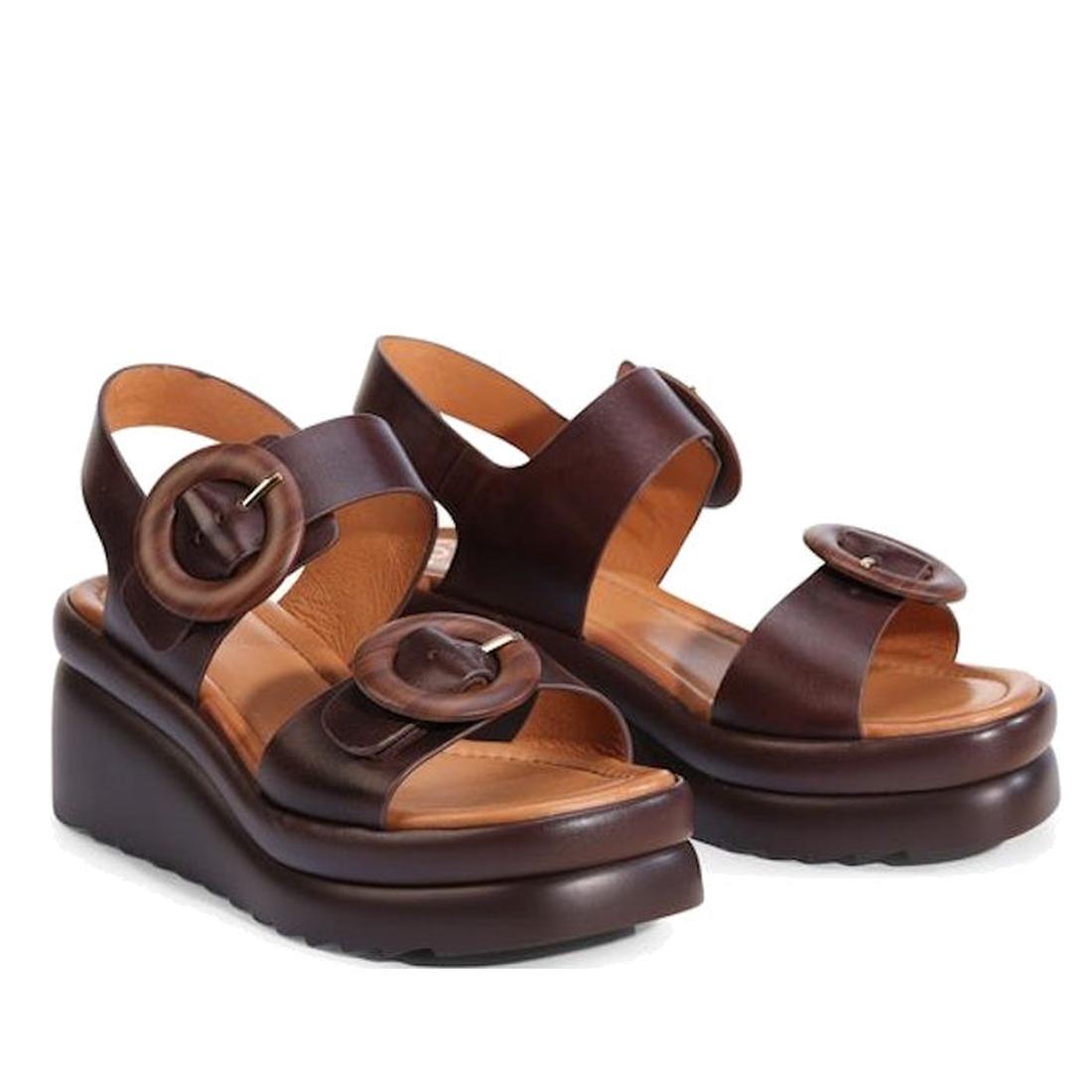 The EOS Menorcas Chestnut Brown Leather Wedge Sandal features thick soles, large circular buckle straps, and contoured arch support for comfort., 49568, 49569, 9321191310664, 9321191310671, 9321191310688, 49573, 49574