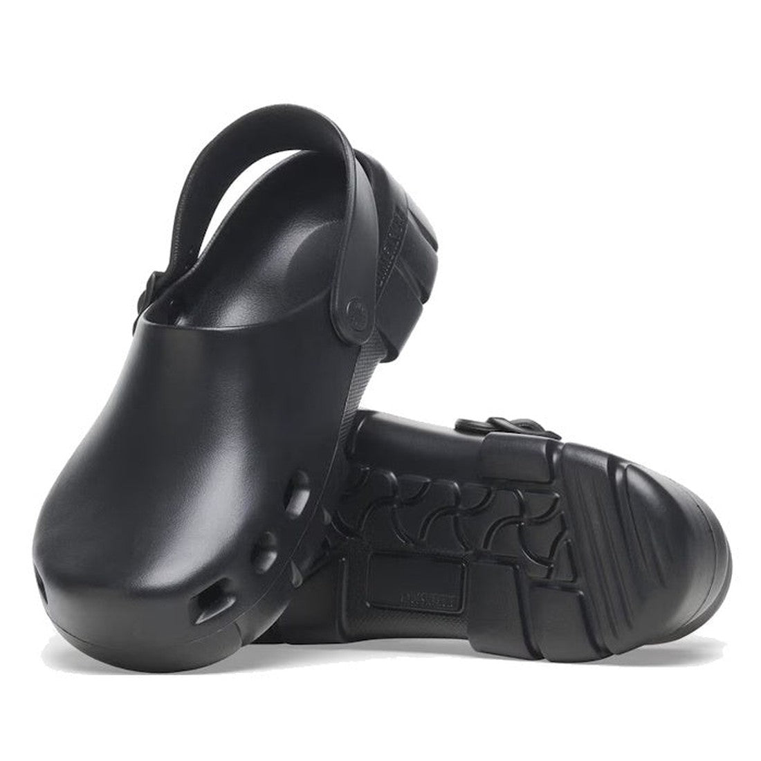 A pair of Birkenstock Birki Flow EVA Black clogs (Regular Width) with ventilation holes and adjustable slingback straps, shown upright and on their side to highlight the textured, arch-supportive sole.