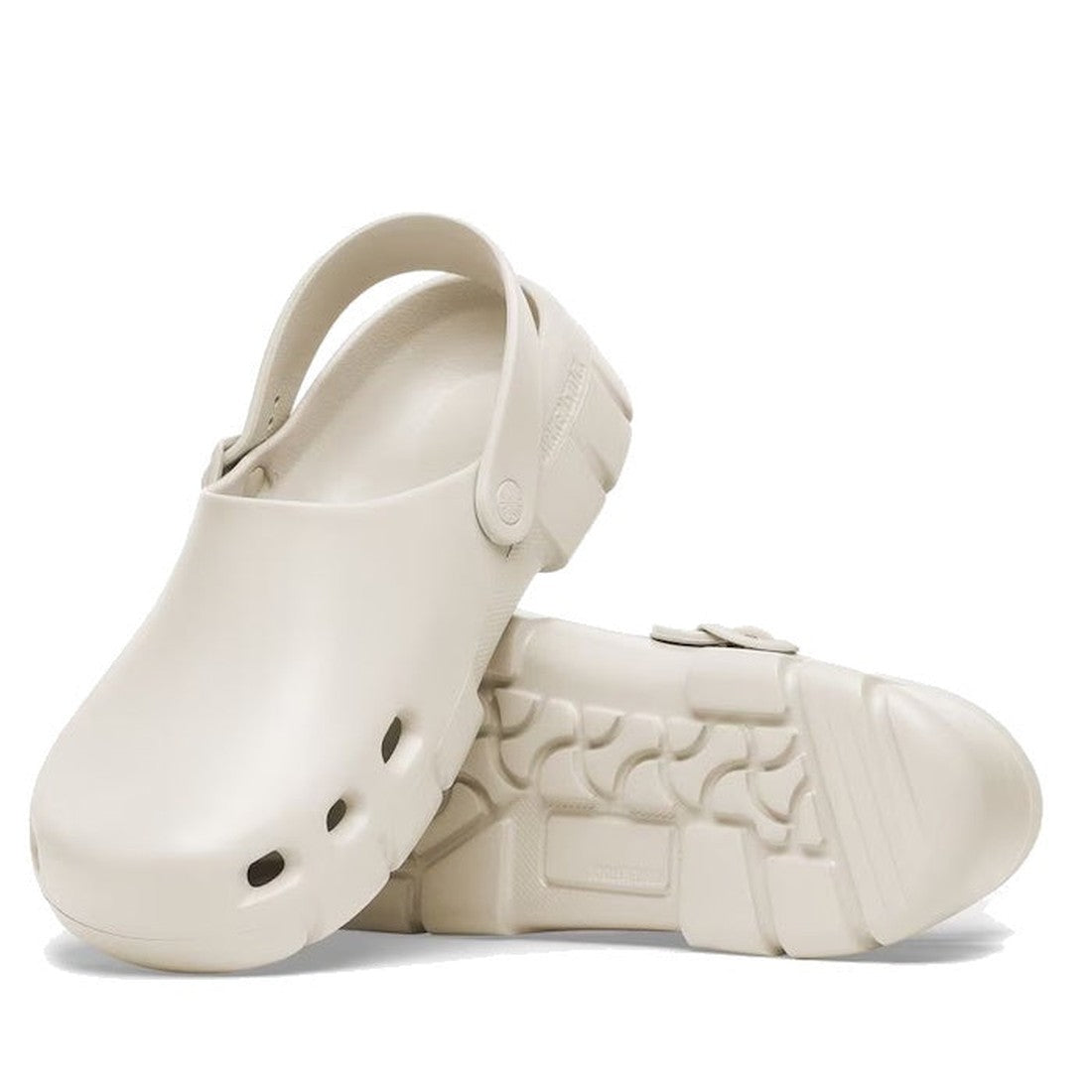 A pair of Birkenstock Birki Flow EVA EggShell clogs (Regular Width) on clearance—one upright, one on its side—showing the arch-support sole, textured tread, and toe vents. Waterproof, washable, and ideal for everyday wear.