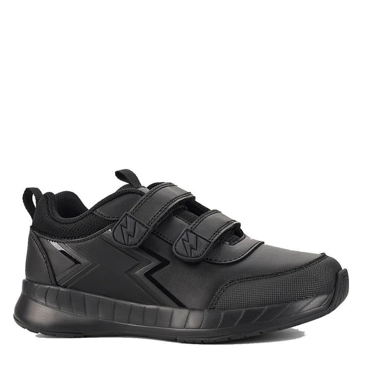 The Harrison Heat Black School Trainer features a scuff-resistant leather upper, two hook-and-loop Velcro straps, a black zigzag side design, heel pull tab, and a thick textured sole.