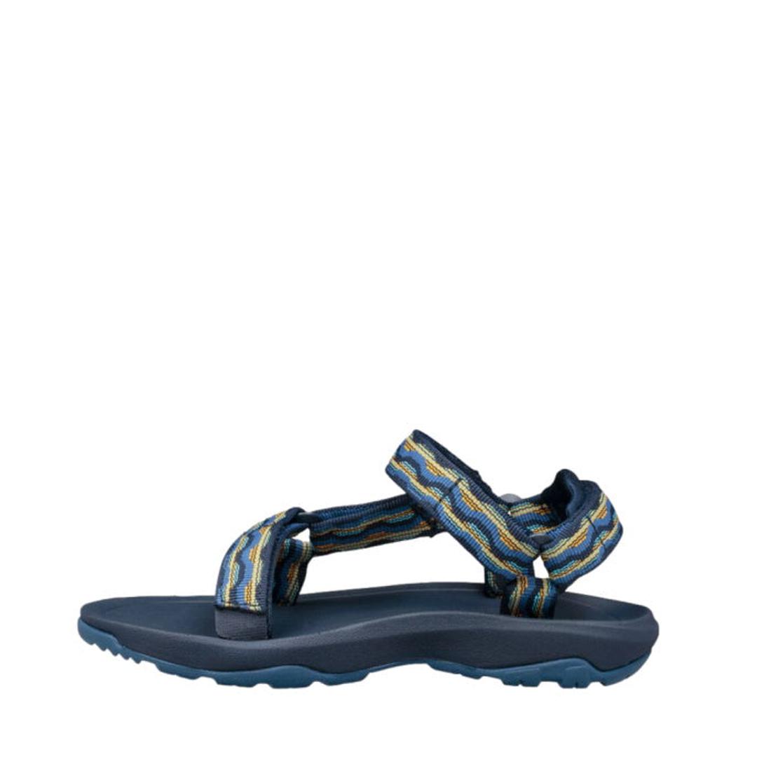 The Teva Kids K Hurricane XLT2 Kishi Dark Blue sandal features adjustable yellow and blue patterned straps, a thick textured recycled sole, open toes, and is displayed against a white background., 192410699667, 192410699674, 192410699681, 192410699636, 19, 192410699643, 192410699650, 192410700707, 192410700745, 192410700752, 192410700769