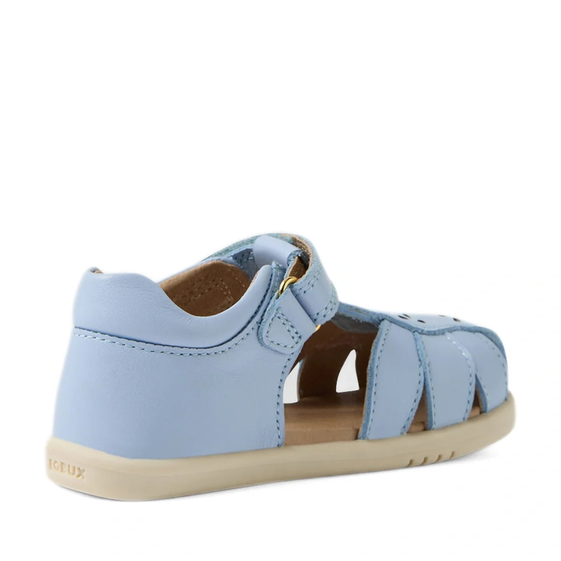 The Bobux IWalk Holly Toddlers Sandal in Skyway Blue features a closed toe, closed heel, and open sides. Made from quick-drying leather, these sandals have a Velcro strap for easy fastening, a beige flat sole, and visible stitching on the heel., 942007485