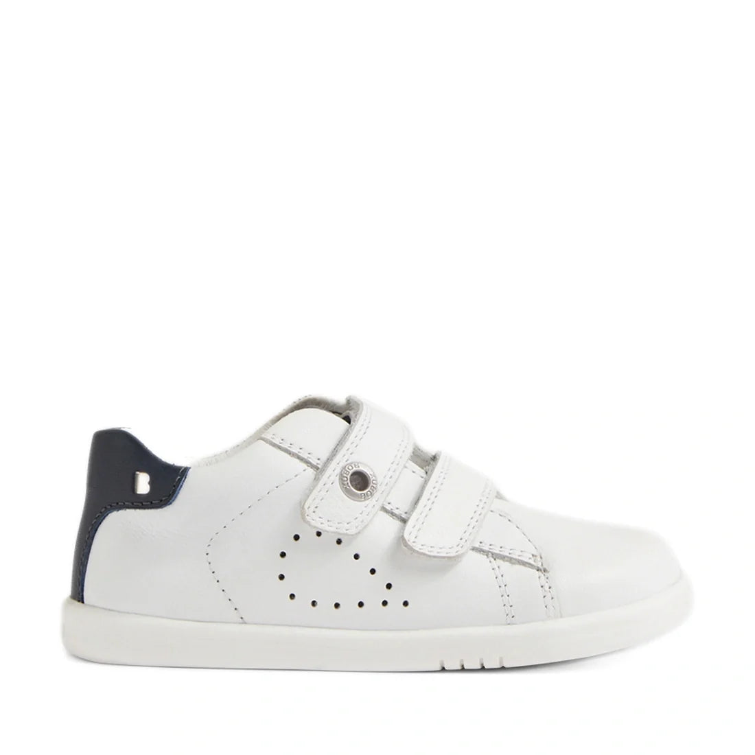 The Bobux IW Iwalk Maverick Toddlers Leather Sneaker in White Navy is a kids’ leather sneaker featuring two Velcro straps, small side perforations, and a navy blue accent on the heel. These adjustable strap sneakers have a simple, sporty design and are sh