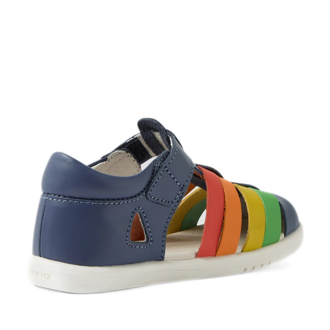 The Bobux IWalk Tidal Sandal Multi Vintage Indigo Closed Toe Toddlers features a navy blue heel and vibrant straps in red, orange, yellow, and green. With a closed-toe design, open side cutout, and white sole, these stylish sandals are both comfortable an