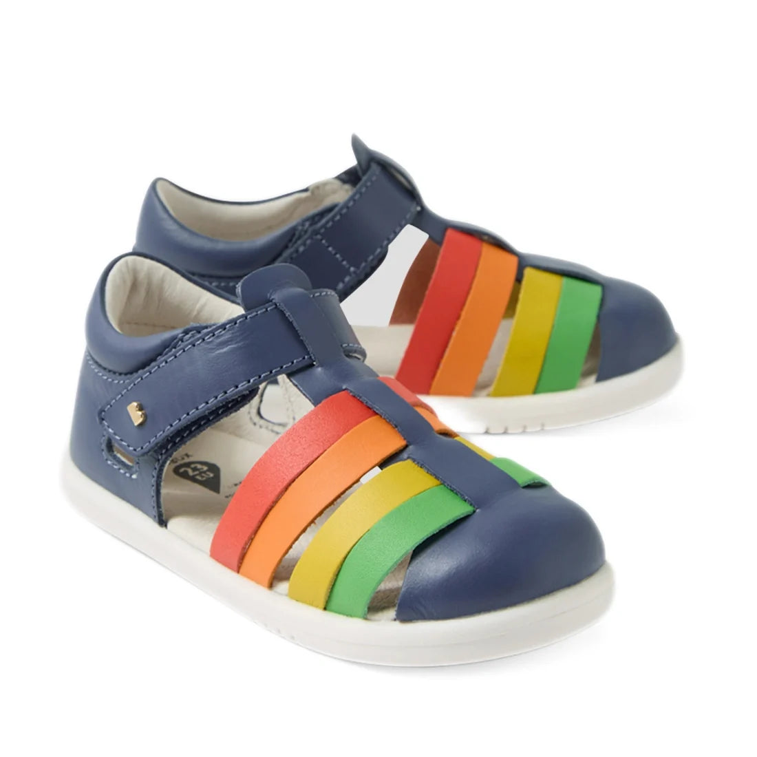 The Bobux IWalk Tidal Sandal Multi Vintage Indigo Closed Toe Toddlers feature a vibrant design with blue uppers and a white sole, complemented by colorful straps in red, orange, yellow, and green across the top. These closed-toe sandals for toddlers are e