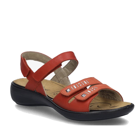 The Josef Seibel Ibiza 86 Women’s Leather Comfort Sandal in Rot Red features two velcro straps adorned with silver accents, a slingback strap, a cushioned tan insole, and a black low wedge sole—making it an ideal choice for stylish women’s sandals.