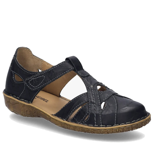 The Josef Seibel Rosalie 29 Black Leather Women’s Covered Toe Sandal features a closed-toe design with cutout details, a tan interior, and a brown textured sole with white stitching. Finished with a Velcro strap closure across the top, these stylish and p
