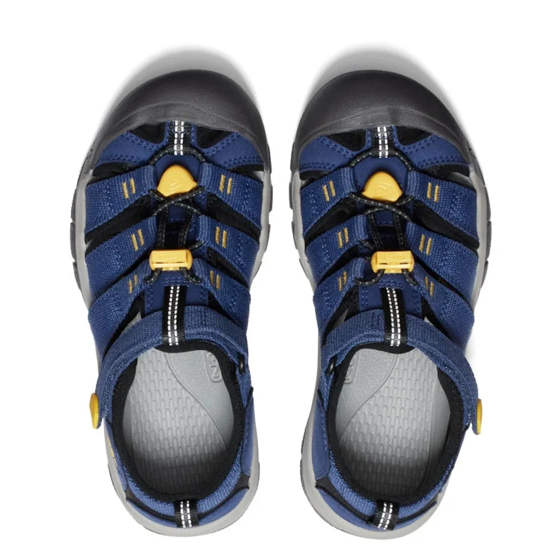 Top view of a pair of Keen Kids Newport H2 sandals in Blue Naval/Academy Yellow (US 8 toddlers to 6 youths), featuring black and blue closed-toe design with yellow accents, durable Velcro adjustable straps, and grippy non-marking soles, placed side by sid