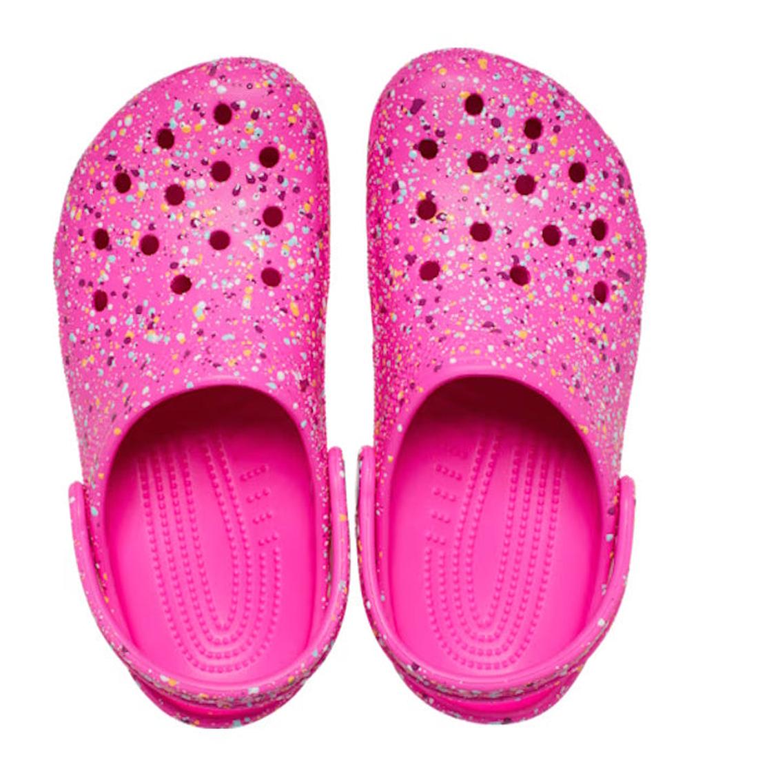 The Crocs Kids - Youths Classic Clog K Paint Splatter Print in bright pink multi features colorful glitter speckles and ventilation holes, shown from above against a white background., 198445210228, 198445210235, 198445210242, 198445210259, 198445210266, 