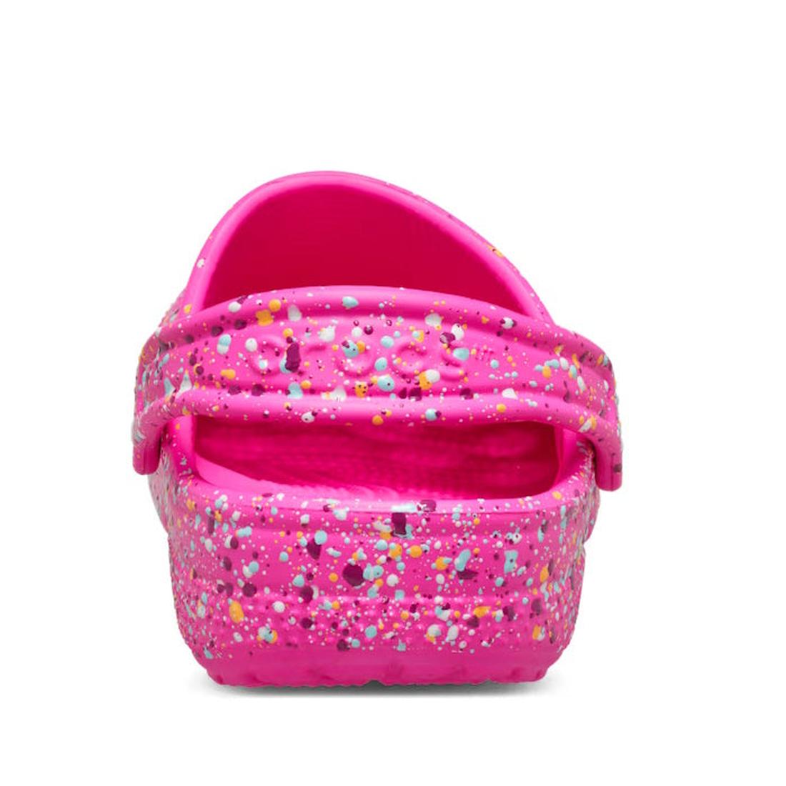 The Crocs Kids - Toddlers Classic Clog K Paint Splatter Print Bright Pink Multi features a bright pink back-strap clog, accented with yellow, blue, white, and purple speckles—lightweight and perfect for toddlers., 198445214196, 198445214202, 198445214219,