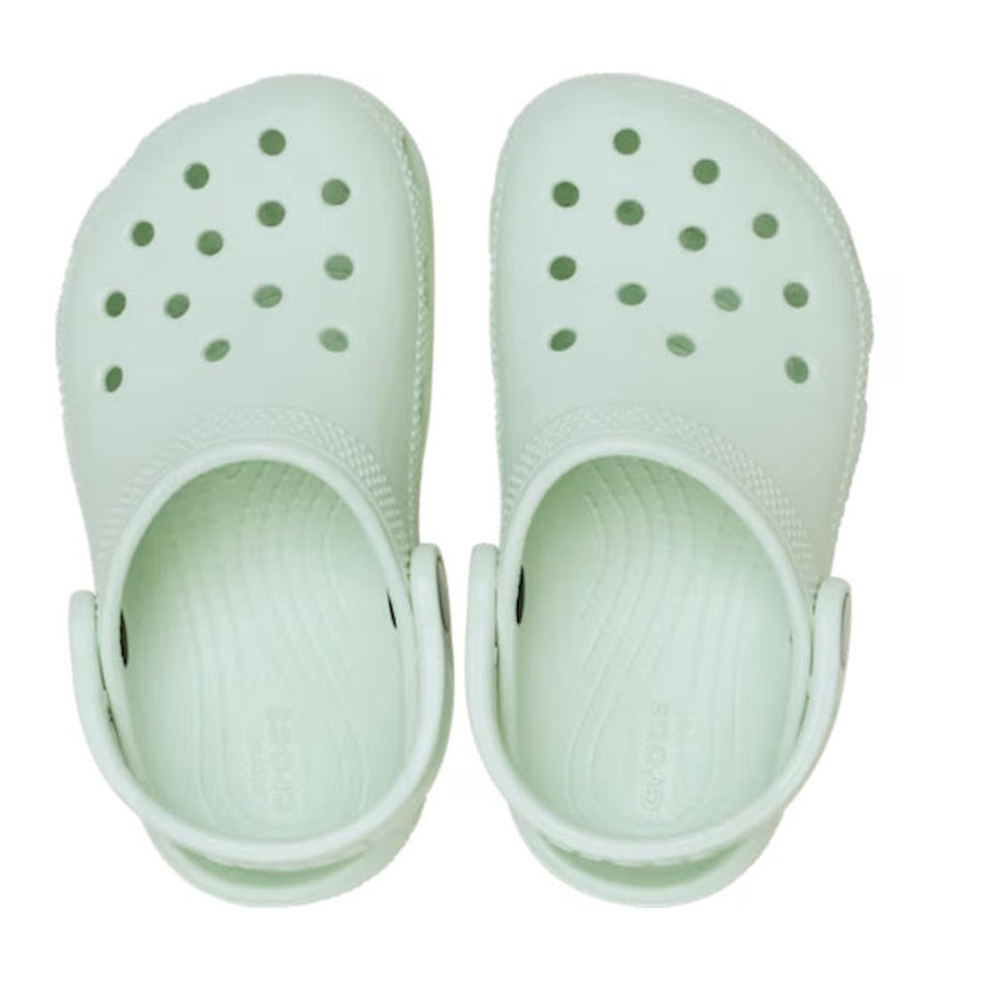 Top down view of a Pair of toddlers classic clogs in mint tint light green clogs on a white background.,
198445206931,
198445206948,
198445206955,
198445206962,
198445206900,, 46491, 198445206931, 198445206948, 198445206955, 198445206962, 198445206900